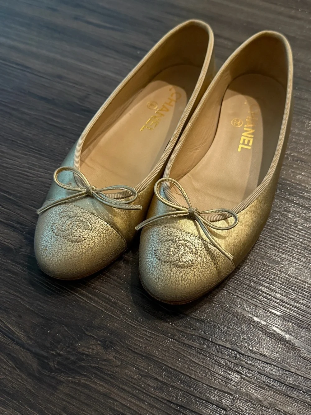 CHANEL Metallic Gold Leather Ballet Flats with Bow Accent